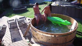 Teenagers party hard in hot tub while playing toys