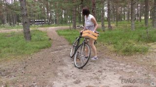 Sonja was riding her naked bike through the forest, feeling the wind on her bare skin and the sun warming her up