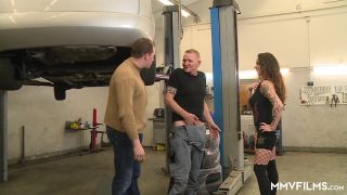 Eva Shwarz, the hot and busty blonde babe from MMVFilms, is getting her tight ass fucked by a big black cock in an industrial garage