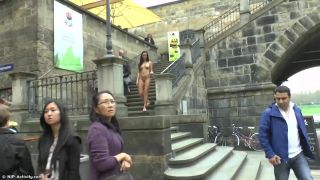 Victoria's nipples were hard and erect as she stood in the middle of the crowded street, completely naked