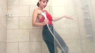 A: Watch as she gets soaked in the shower, her tits and ass on full display